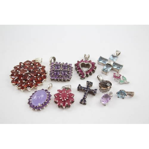 342 - A collection of silver gemstone pendants including Ruby (39g)