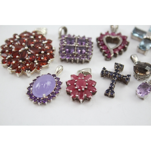 342 - A collection of silver gemstone pendants including Ruby (39g)