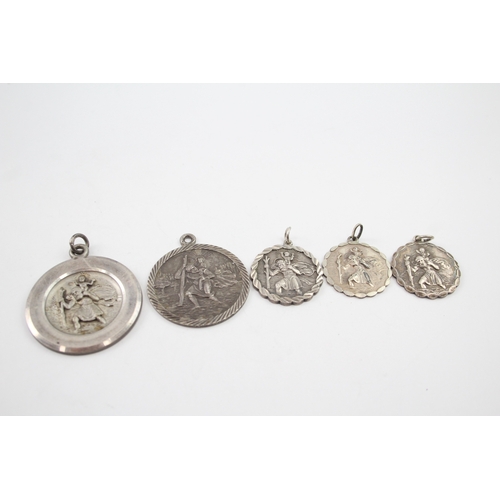 343 - Five silver St Christopher pendants including Georg Jensen (46g)