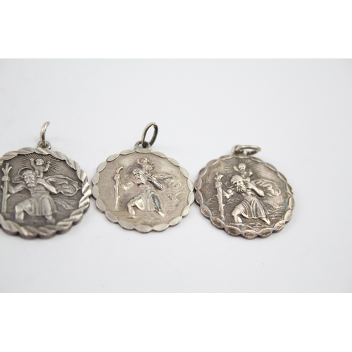 343 - Five silver St Christopher pendants including Georg Jensen (46g)