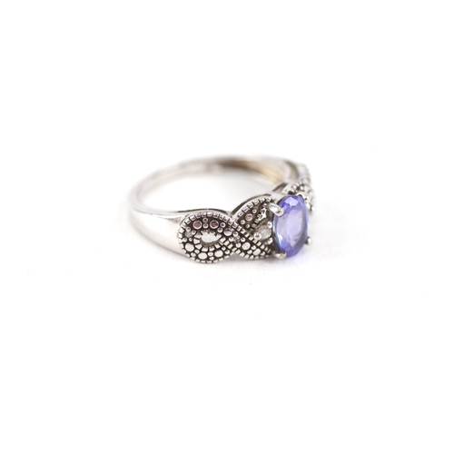 48 - 9ct white gold tanzanite single stone ring with diamond sides (2.2g) Size  J 1/2