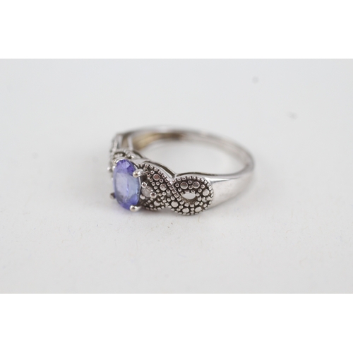 48 - 9ct white gold tanzanite single stone ring with diamond sides (2.2g) Size  J 1/2