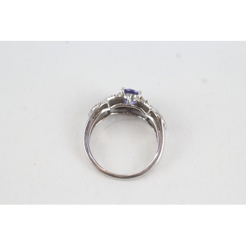 48 - 9ct white gold tanzanite single stone ring with diamond sides (2.2g) Size  J 1/2