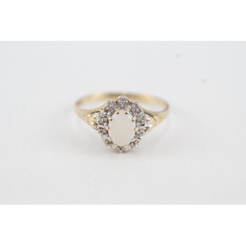 54 - 9ct gold diamond & opal oval cluster ring (1.8g) Size  O 1/2