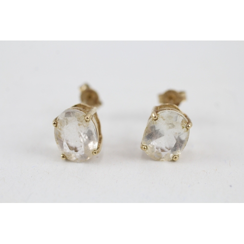 60 - 9ct gold oval goshenite single stone stud earrings (2.3g)