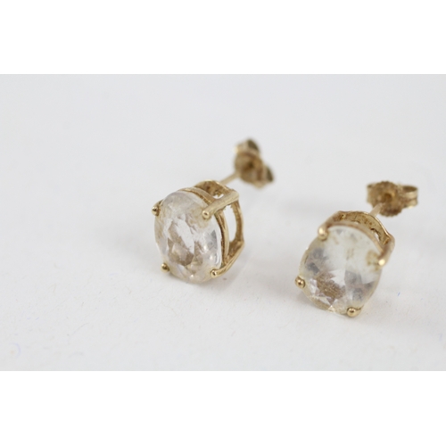 60 - 9ct gold oval goshenite single stone stud earrings (2.3g)