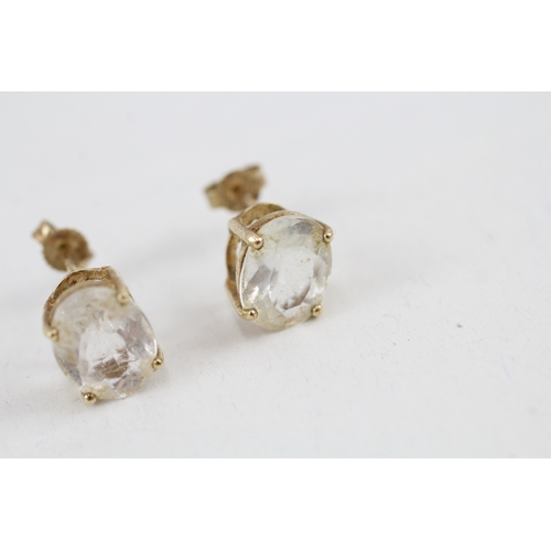 60 - 9ct gold oval goshenite single stone stud earrings (2.3g)