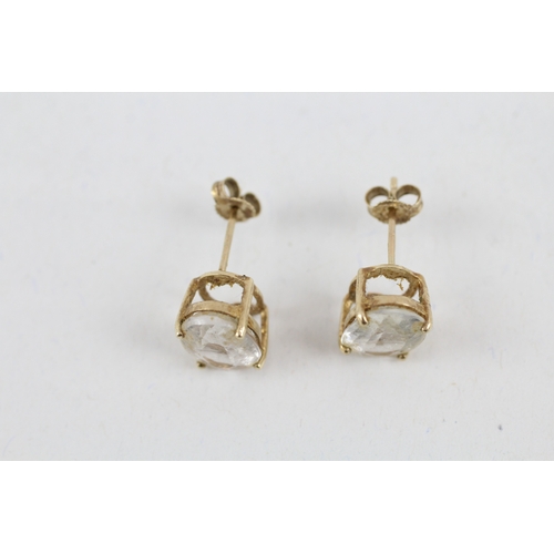 60 - 9ct gold oval goshenite single stone stud earrings (2.3g)