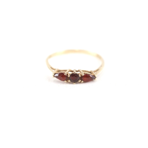 74 - 9ct gold garnet three stone ring (0.8g) Size  N 1/2