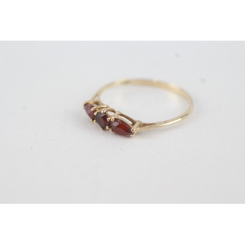 74 - 9ct gold garnet three stone ring (0.8g) Size  N 1/2