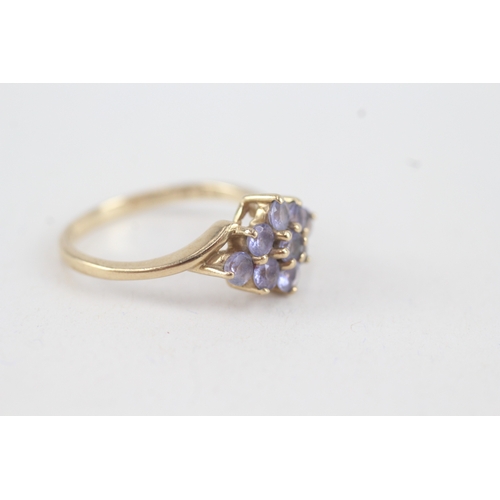 76 - 9ct gold tanzanite lozenge shaped cluster ring (2.9g)