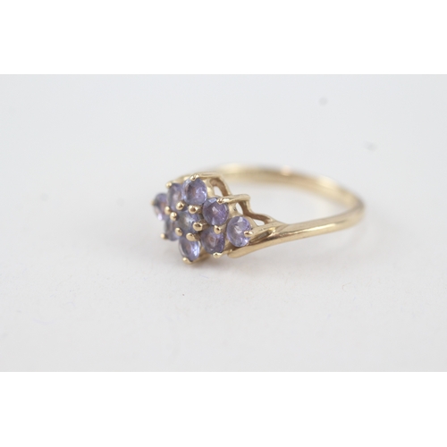 76 - 9ct gold tanzanite lozenge shaped cluster ring (2.9g)