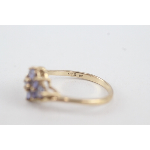 76 - 9ct gold tanzanite lozenge shaped cluster ring (2.9g)