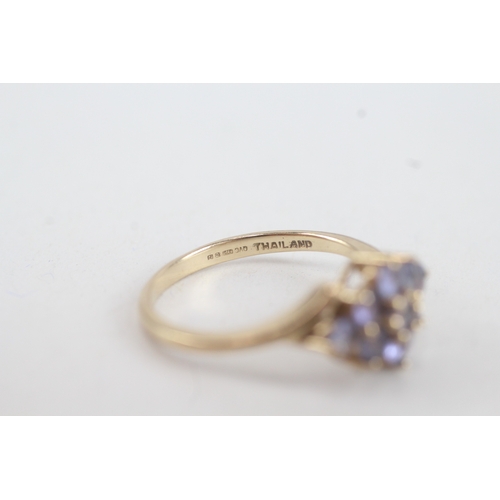 76 - 9ct gold tanzanite lozenge shaped cluster ring (2.9g)