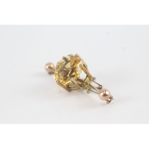 91 - 9ct gold hexagonal citrine single stone bar brooch with base metal pin (6.6g)