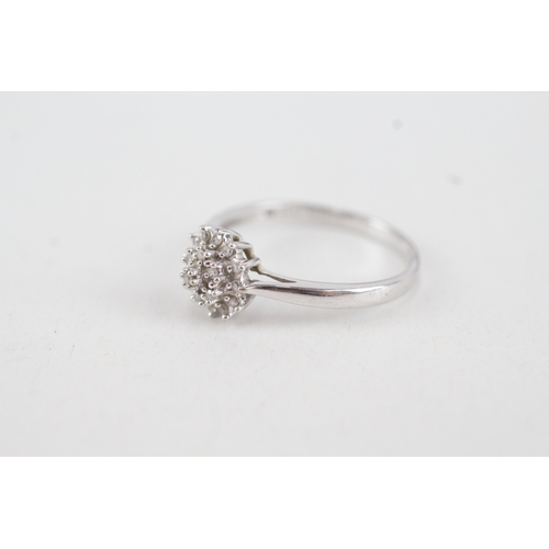 93 - 9ct white gold diamond floral cluster ring (1.7g) Size  P