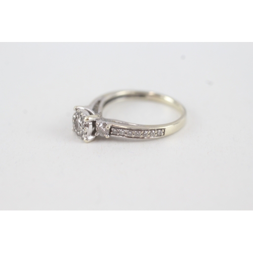 95 - 9ct white gold diamond halo ring with diamond set shoulders (2.2g) Size  R