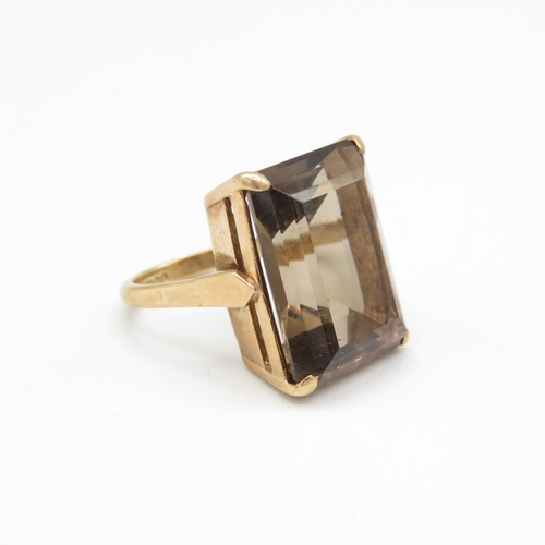 114 - 9ct gold vintage smokey quartz dress ring (8.9g) Size  M 1/2