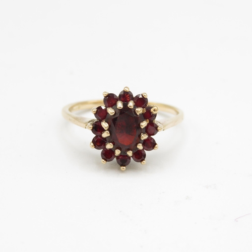 132 - 9ct gold garnet oval cluster ring (2.8g) Size  P 1/2