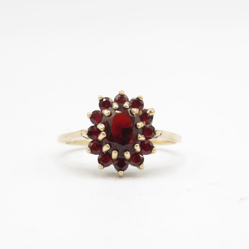 132 - 9ct gold garnet oval cluster ring (2.8g) Size  P 1/2