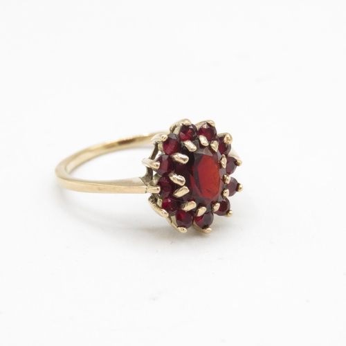 132 - 9ct gold garnet oval cluster ring (2.8g) Size  P 1/2