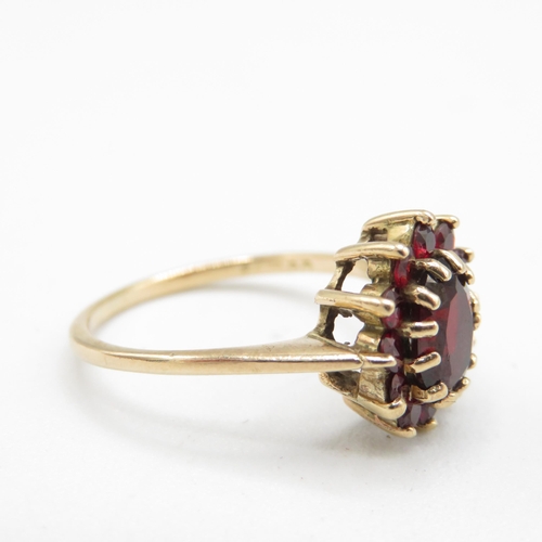 132 - 9ct gold garnet oval cluster ring (2.8g) Size  P 1/2