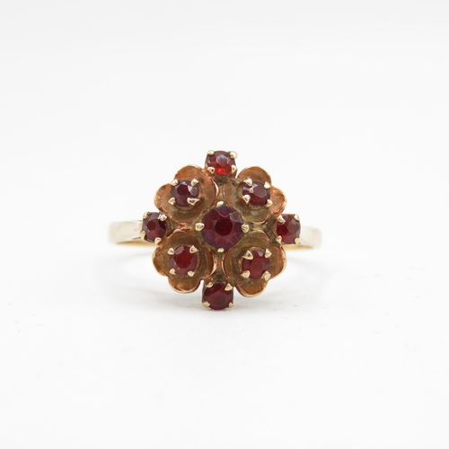 134 - 9ct gold garnet floral cluster ring (2.2g) Size  P 1/2