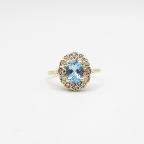 144 - 9ct gold diamond & aquamarine oval halo ring (1.7g) Size  J 1/2