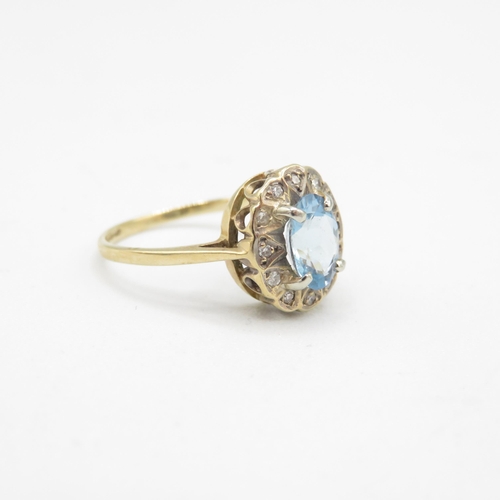 144 - 9ct gold diamond & aquamarine oval halo ring (1.7g) Size  J 1/2