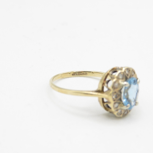 144 - 9ct gold diamond & aquamarine oval halo ring (1.7g) Size  J 1/2