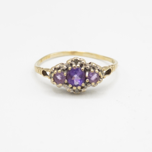 146 - 9ct gold amethyst three stone ring with diamond surround (1.6g) Size  T