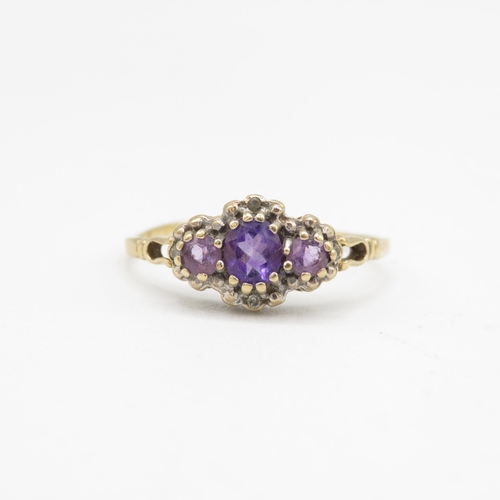 146 - 9ct gold amethyst three stone ring with diamond surround (1.6g) Size  T