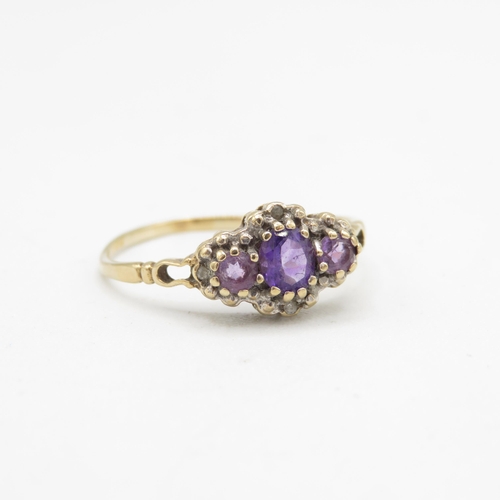 146 - 9ct gold amethyst three stone ring with diamond surround (1.6g) Size  T