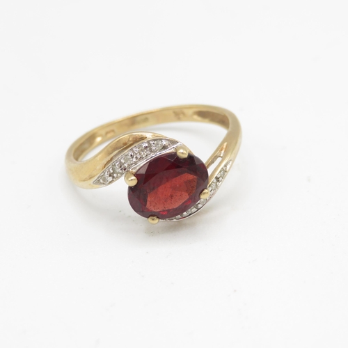 155 - 9ct gold garnet & diamond dress ring (2.5g) Size  R