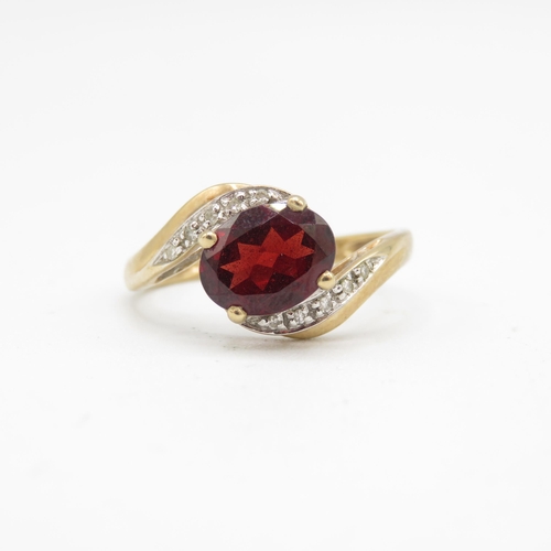 155 - 9ct gold garnet & diamond dress ring (2.5g) Size  R