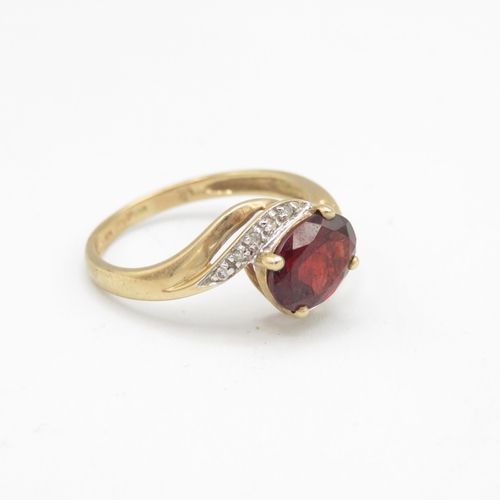 155 - 9ct gold garnet & diamond dress ring (2.5g) Size  R