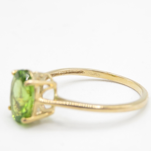 161 - 9ct gold peridot single stone ring (1.9g) Size  R