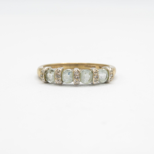 177 - 9ct gold topaz four stone ring with diamond spacers (2.3g) AS SEEN - MISHAPEN Size  O