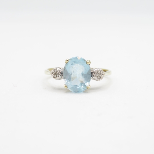 205 - 9ct gold oval cut blue topaz & diamond three stone ring (1.9g) Size  N 1/2