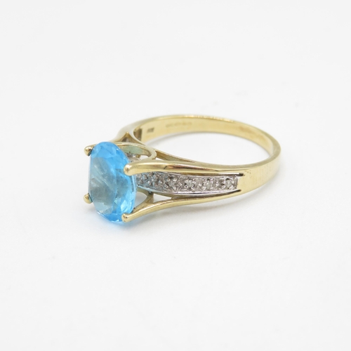 209 - 9ct gold oval cut blue topaz & diamond dress ring (3.3g) Size  Q