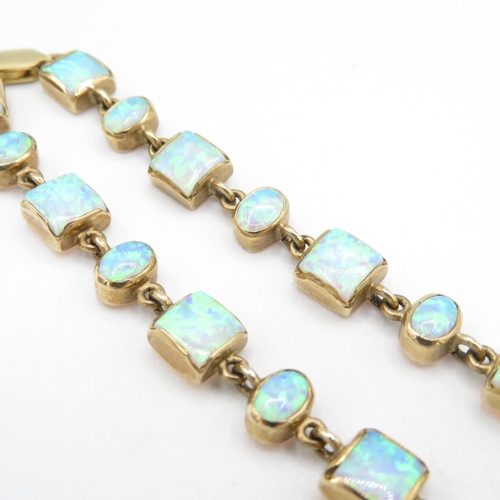 215 - 9ct gold vari-cut synthetic opal bracelet (11.6g)