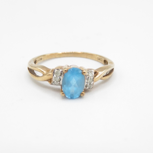 217 - 9ct gold blue topaz & diamond ring (1.9g) Size  P 1/2