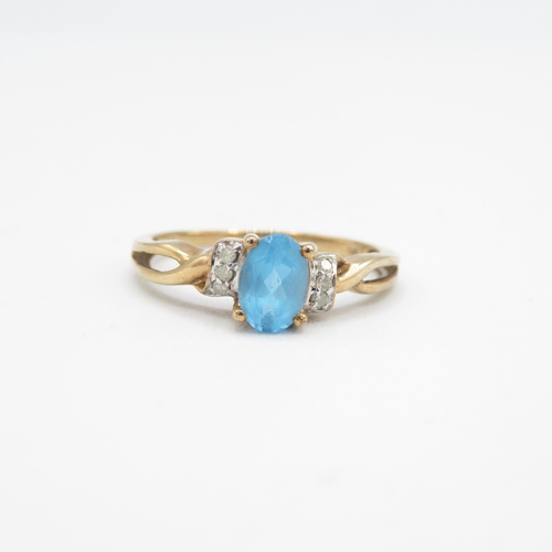 217 - 9ct gold blue topaz & diamond ring (1.9g) Size  P 1/2