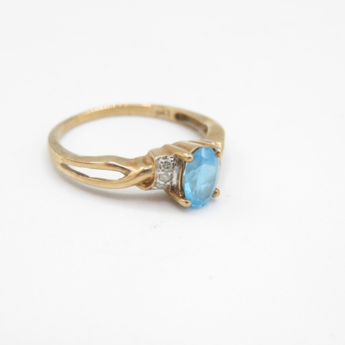 217 - 9ct gold blue topaz & diamond ring (1.9g) Size  P 1/2