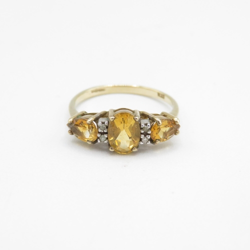 218 - 9ct gold oval cut citrine & diamond dress ring (2g) Size  O 1/2