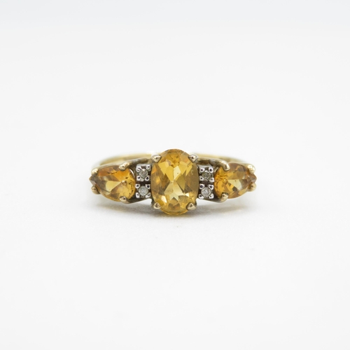 218 - 9ct gold oval cut citrine & diamond dress ring (2g) Size  O 1/2