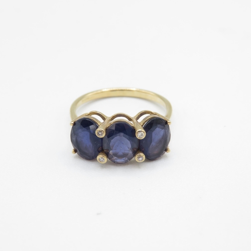 219 - 9ct gold oval cut iolite & diamond dress ring (2.4g) Size  O