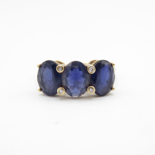 219 - 9ct gold oval cut iolite & diamond dress ring (2.4g) Size  O