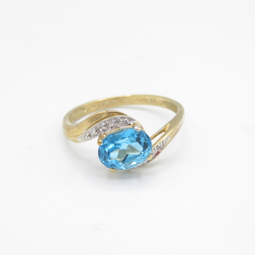 220 - 9ct gold oval cut blue topaz & diamond dress ring (3.1g) Size  W