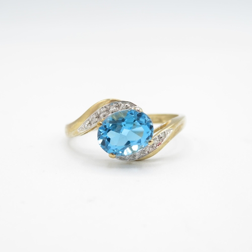 220 - 9ct gold oval cut blue topaz & diamond dress ring (3.1g) Size  W